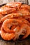 Boiled large shrimp close-up on a plate. vertical