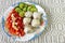 Boiled meatballs with vegetables and sauce