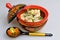 Boiled pelmeni in khokhloma painted russian wooden dishes with spoon