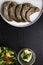 boiled pork and beef tongue and glass bowl with mayonnaise, vegetable salad