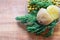 Boiled potatoes, green peas and dill greens on wooden background