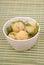 Boiled potatoes with parsley on a bamboo