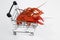 Boiled red crayfish lobsters on a shopping basket, funny photo for supermarkets and shopping,,