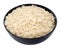 Boiled rice in a black bowl close-up isolated