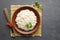 Boiled rice, chopsticks and bamboo napkin on a gray concrete background.