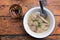 Boiled rice with pork and steamed pork sausage in White zinc bowl.