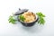 boiled rice with vegetables and meat in a ceramic bowl