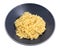 Boiled risoni pasta in gray bowl isolated