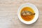 Boiled salty and sweet mackerel fish sauce soup on plate