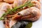 Boiled shrimp prawn whole with spices. Pink shrimps with a sprig of thyme and bay leaf
