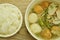 Boiled slice pork and meat ball with tofu soup on bowl eat couple plain rice cup