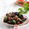Boiled small black fungus cold dish on white table background