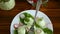 Boiled stuffed eggs with green cheese filling with arugula leaves and radish