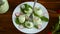 Boiled stuffed eggs with green cheese filling with arugula leaves and radish