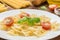 Boiled tasty farfalle on white plate