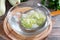 Boiled vegetables, zucchini in a colander in ice water after blanching. Frozen Food