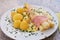 Boiled white asparagus with the ham and fresh new boiled potatoes served with the hollandaise sauce.