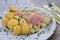 Boiled white asparagus with the ham and fresh new boiled potatoes served with the hollandaise sauce.