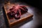 Boiled whole octopus on a wooden cutting board. Cooking seafood dishes. Dark background. Protein food. Free place