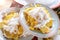 Boiled yellow Corn and slice, with white coconut and sugar in plate stacking, ready to serve, close up