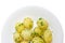 Boiled young potatoes with dill on the white dish closeup