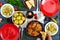 Boiled young potatoes, fried zucchini slices, schnitzels on a wooden table. Top view. Served table for family dinner, lunch.