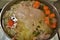 Boiling Chicken in Pot with Vegetables to make chicken broth