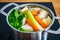 Boiling chicken soup in pot