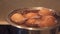 Boiling eggs on a gas stove. Top view close-up