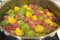 Boiling mixed vegetarian ravioli cooking in a pan