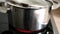 Boiling potatoes in hot water in silver pot on ceramic stove show authentic cooking at home to prepare healthy meal with cooking p