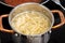 Boiling spaghetti in cooking pot