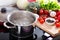 Boiling water in a cooking pot on the cooker