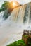 Boiling water foam, crashing and falling jets, a fine mist over the water. The most high-water waterfall in the world - Iguazu.