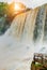 Boiling water foam, crashing and falling jets, a fine mist over the water. The most high-water waterfall in the world - Iguazu.