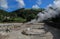 Boiling water and hot steam venting from Caldeira Grande Big boiler in small town Furnas, SÃ£o Miguel island in Azores