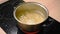 Boiling water in a metal saucepan and cooking long pasta spaghetti macaroni in water