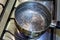 Boiling water in a steel casserole pot