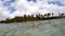 Bois Jolan beach on a cloudy day seen from the water. Guadeloupe, Caribbean sea