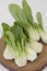 Bok choy chinese cabbage in a wooden board