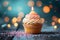 Bokeh background, birthday cupcake, burning candle, festive celebration delight