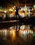 Bokeh backlight girl silhouette after rain on the street at night