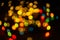 Bokeh on black background for use in photo editor. Beautiful bright curly bokeh. Magic background for new year and Christmas.