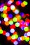 Bokeh of blurred Christmas lights - all colours - green, blue, orange, white, red