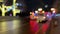 Bokeh car lights in the evening city. Defocused headlights and street lighting at night. Moving bokeh circles of cars at
