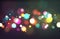 Bokeh. Color light glowing blurry sparkles on black. Luxury festive magical christmas background with bokeh effect