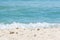 Bokeh effect on the beach with water in the background and fine sand in the foreground defocused