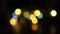 Bokeh flashlights. Christmas colored blurred winter background. Blinking Christmas garland with blurry light. Happy New Year