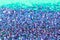 Bokeh Glitter Background in blue, red, green, and purple