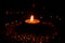 Bokeh image of burning tealight candle